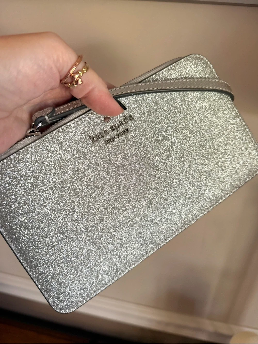 kate spade Lucy Silver Glitter Wristlet in color Lunar Light Like new